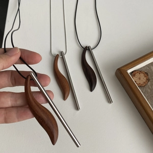 Irregular ebony moon crescent whistle necklace with titanium steel long sweater chain