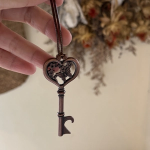 Vintage bronze butterfly heart key necklace and bottle opener with brown woven cord