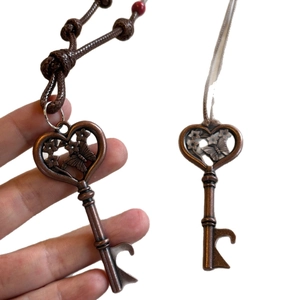 Vintage bronze butterfly key necklace with heart-shaped openwork and corkscrew detail