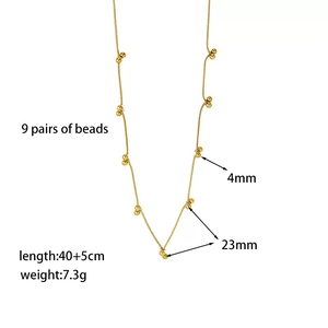 Collier en acier inoxydable plaqué or 18K avec neuf paires de billes dorées de 4mm