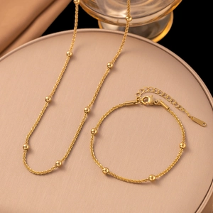 Elegant gold plated stainless steel necklace and bracelet set with bead details