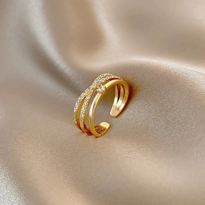 Three-layer gold-plated open ring with pave-set zircon stones on champagne silk