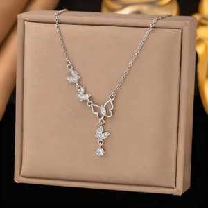 Elegant silver butterfly necklace with sparkling zircon tassels and hollow butterfly pendant