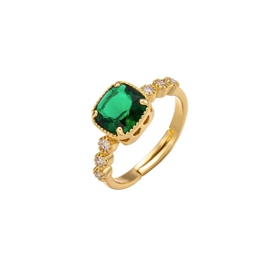 Minimalist gold ring with emerald cut green stone and sparkling zircon accents