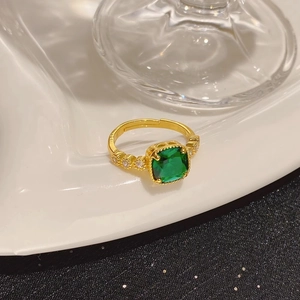Exquisite gold adjustable ring with emerald square stone and zircon side accents