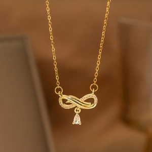 Golden infinity necklace with sparkling diamonds and a teardrop pendant for women