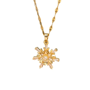 Elegant gold titanium necklace with sparkling zircon snowflake pendant in a minimalist style