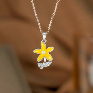 Daisy flower necklace with yellow petals, white pearl center and sparkling zircons