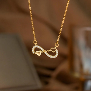 Elegante goldene Unendlichkeit Herz Halskette mit funkelnden Zirkonia und EKG Linie