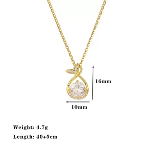 Elegant gold fishtail necklace with circular crystal pendant and sparkling micro-diamonds