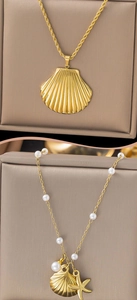 Detailed macro view of gold titanium steel starfish and seashell ocean series necklace