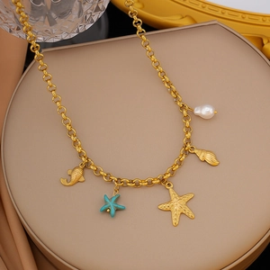 Detailed view of ocean theme necklace with golden starfish shells and blue star charms