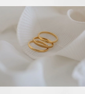 Three-piece gold plated stainless steel ring set with frosted and polished finishes