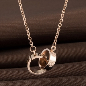 Elegant rose gold double interlocking circle necklace with industrial screw pattern