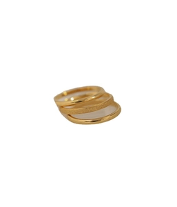 Three-piece stackable gold plated titanium ring set with matte and polished finishes