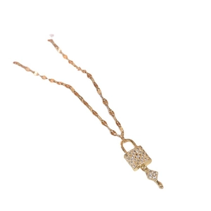 Elegant gold titanium steel necklace with zircon encrusted lock and clover key pendant