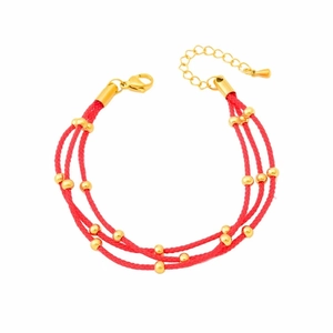 Three-layer braided red rope bracelet with golden beads and adjustable lobster clasp