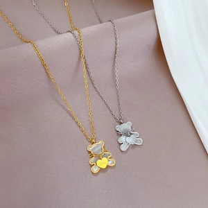 Cute teddy bear heart necklace in gold and silver finish with shell inlay and Love detail