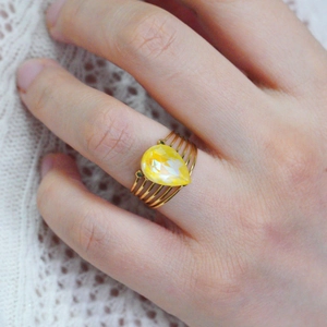 Vintage stainless steel open ring with yellow pear-cut stone and multi-layer gold band