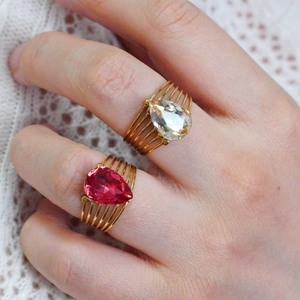 Vintage stainless steel open rings with pear-cut pink and clear stones on gold bands