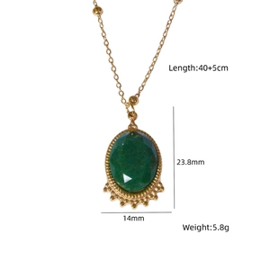 Detail view of gold beaded chain with green gemstone pendant showing 40+5cm length specs