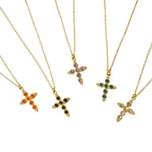 Golden cross necklaces with colorful gemstones in orange, purple, green, black and white