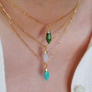 Three-layer gold necklace with green, pink, and blue hexagonal natural stone pendants