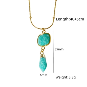 Detail of turquoise pendant necklace with dimensions 35mm by 6mm on a 40cm golden chain