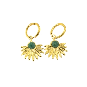Detail of golden hoop earrings featuring green stone sunburst leaf charms on white back