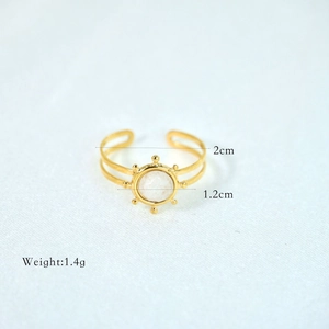 Detailed size view of a gold boho stainless steel ring with white round stone inlay