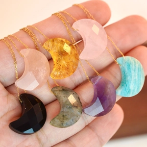 Seven colorful moon-shaped gemstone necklaces in faceted cut with fine gold-plated chains