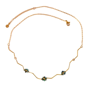 Golden stainless steel necklace featuring turquoise bead flowers and clear gemstones