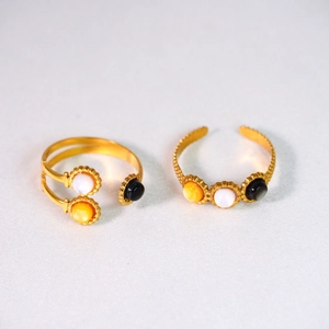 Detail of 14K gold plated stainless steel rings with colorful shell stone inlay