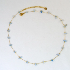 Detail of light blue natural stone beads with golden stainless steel chain and lobster clasp