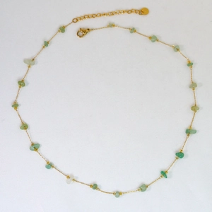 Detailed view of handmade gold chain necklace with green natural stones and lobster clasp