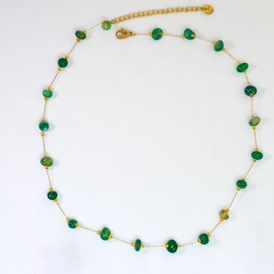 Detail of green natural stone beads and gold stainless steel chain necklace with clasp