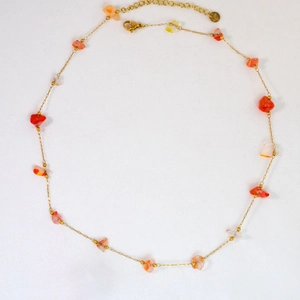 Detail of handmade stainless steel gold chain necklace with natural orange agate stones
