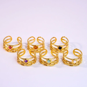 Set of six gold stainless steel rings with colorful round inlaid natural stones