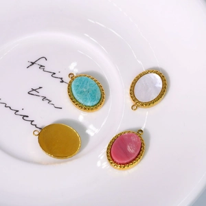 French vintage stainless steel oval pendants with natural stones and gold twisted borders