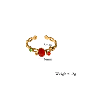 Detail of adjustable gold ring with red stone (8x6mm) and floral hollow pattern