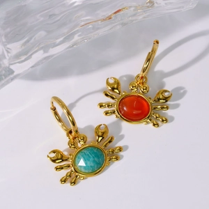 Asymmetric gold crab earrings with red and green stones for summer ocean vacation style