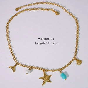Detailed view of ocean theme necklace with starfish whale tail and blue bead