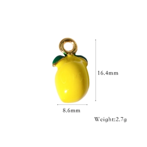 Detailed view of yellow enamel lemon pendant with size dimensions 16.4mm by 8.6mm