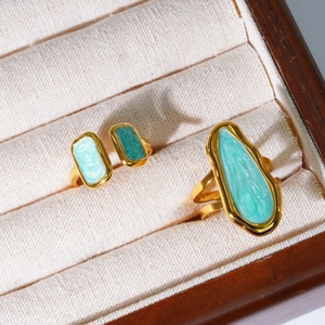 French style irregular gold rings with mint green enamel inlay in a jewelry box