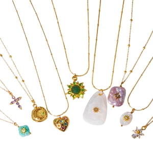 Golden baroque pearl and shell pendant necklaces set with zircon in stainless steel