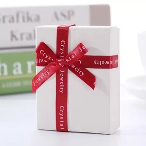 Premium white jewelry gift box with textured finish and elegant red ribbon bow decoration