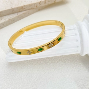 Gold titanium steel bracelet with emerald marquise gems and white clover diamond pattern