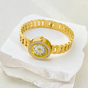 Elegant women's gold hollow chain bracelet watch with diamond bezel on white stones