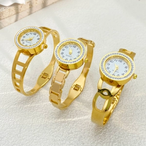 Three gold quartz watches with rhinestone bezels and different hollow bracelet styles