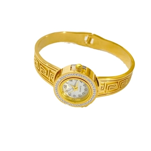 Elegant gold-tone stainless steel bangle watch with Greek key patterns and crystals